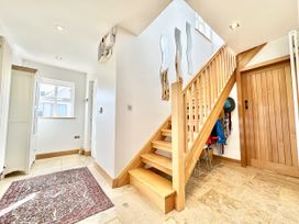 A hallway with staircase and door at Seeview in Charleville