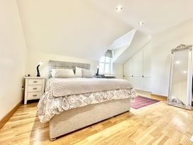 A bedroom with a bed and nightstand at Seeview in Charleville