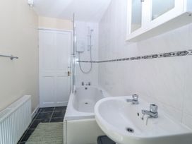 A bathroom with a bathtub and shower at Tegfan near Porthmadog