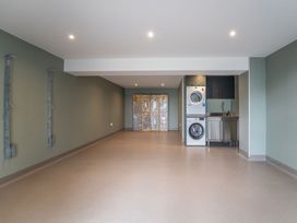 A laundry room with a washing machine and dryer at Bell House in Llanfechell
