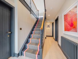 A staircase in a hallway at Bell House Llanfechell