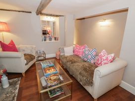 A living room with sofas and a coffee table at 23 New Church Street Tetbury