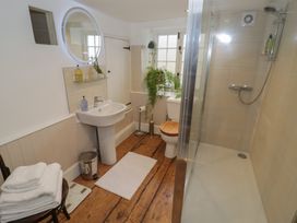 A bathroom with sink, toilet, and shower at 23 New Church Street in Tetbury