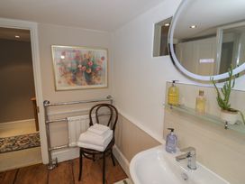 A bathroom with a sink and towels at 23 New Church Street Tetbury