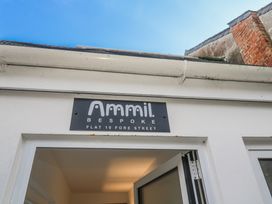 A sign for Ammil Bespoke at the entrance of a flat in St Ives