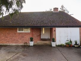 A house with a front door and garage at Three Ways South Lopham near Garboldisham