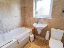 A bathroom with a bathtub, sink, and toilet at Three Ways in South Lopham near Garboldisham