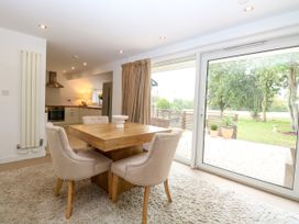 A dining room with a table and chairs at Three Ways South Lopham near Garboldisham