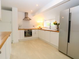A kitchen with an oven and refrigerator at Three Ways in South Lopham near Garboldisham