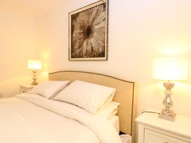 A bedroom with a bed and bedside tables at Three Ways South Lopham near Garboldisham