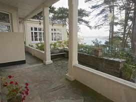 An outdoor area with a slate patio and potted plants at 4 Ringrone Salcombe