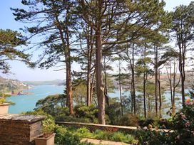 A view of a coast with trees and water at 4 Ringrone Salcombe