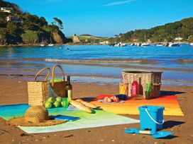 A beach picnic setup with food and drinks at 4 Ringrone, Salcombe