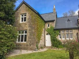 A house with ivy and garden at School House in Ivybridge