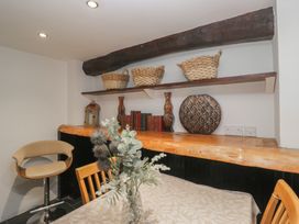 A dining area with a table and chairs at Newlands Fell House near Keswick