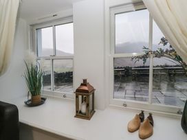 A window with a plant and lantern at Newlands Fell House in Newlands near Keswick