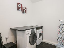 A laundry room with a washing machine and dryer at Newlands Fell House in Newlands near Keswick