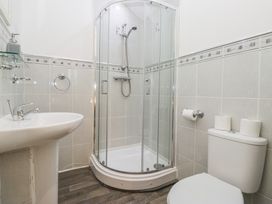 A bathroom with a shower, sink and toilet at Newlands Fell House in Newlands near Keswick