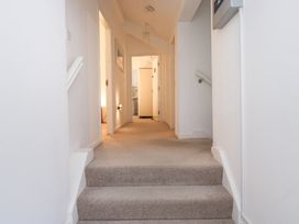 A hallway with stairs leading to rooms at Newlands Fell House near Keswick