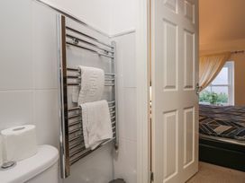 A bathroom with a towel rail and toilet at Newlands Fell House in Newlands near Keswick