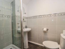 A bathroom with shower and sink at Newlands Fell House in Newlands near Keswick