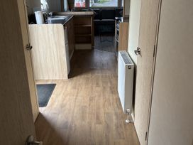 A kitchen with a countertop and cabinets at Gannet 16 (G16) Bridge Of Allan