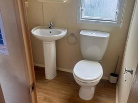 A bathroom with a sink and toilet at Gannet 16 (G16) Bridge Of Allan