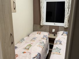 A bedroom with two beds and a window at Jay valley 35 (J35) Lichfield