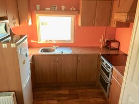 A kitchen with appliances and a window at Gannet 18 (G18) Bridlington