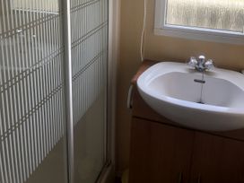 A sink and shower in a bathroom at Gannet 18 (G18) Bridlington