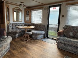 A living room with seating and a coffee table at Gannet 19 (G19) Bridlington