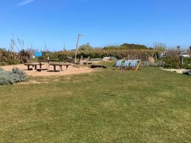 A garden with tables and chairs at Gannet 19 (G19) Bridlington