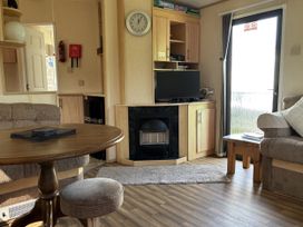 A living room with a television and fireplace at Dunlin dell 45 (D45) Bridlington