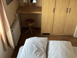 A bedroom with a bed and a desk at Dunlin dell 45 (D45) Bridlington