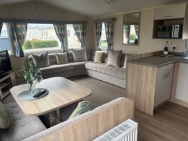 A living room with a sofa and coffee table at Skegness Holiday Park in Skegness