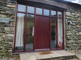 An entrance with a door and window at Newlands Fell Cottage near Keswick