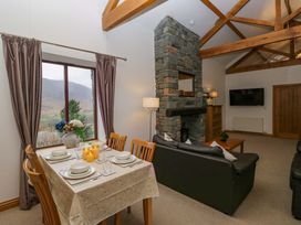 A living room with a table and chairs at Newlands Fell Cottage in Newlands near Keswick