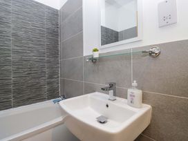 A bathroom with a sink and bathtub at Newlands Fell Cottage in Newlands near Keswick