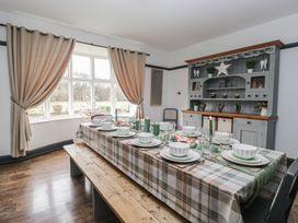 A dining room with a table set for a meal at Herdwick Croft in Bassenthwaite