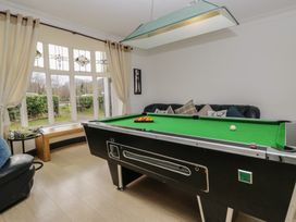 A game room with a pool table and a sofa at Herdwick Croft in Bassenthwaite