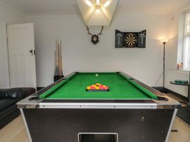 A pool table and dartboard in a snug at Herdwick Croft in Bassenthwaite