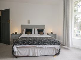 A bedroom with a bed and bedside tables at Herdwick Croft in Bassenthwaite