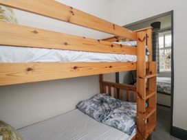 A bunk bed with bedding in a bedroom at Herdwick Croft in Bassenthwaite