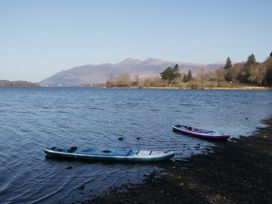 Two kayaks on the shore of a lake at Herdwick Croft in Bassenthwaite