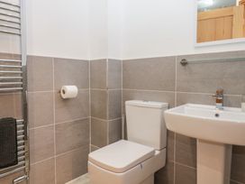 A bathroom with a toilet and sink at Newlands Cottage in Keswick