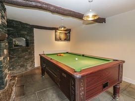 A games room with a snooker table and a darts board at Birkbank Farm Cockermouth