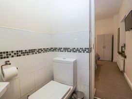 A bathroom with a toilet and sink at Birkbank Farm Cockermouth