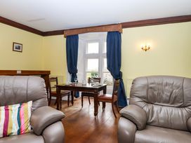 A dining room with chairs and a table at Dowrich West Wing Apartment in Crediton