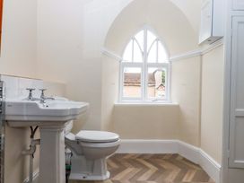 A bathroom with a sink and toilet at Dowrich West Wing Apartment in Crediton