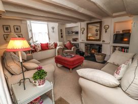 A living room with a coffee table and sofa at Mariners Cottage in Bideford